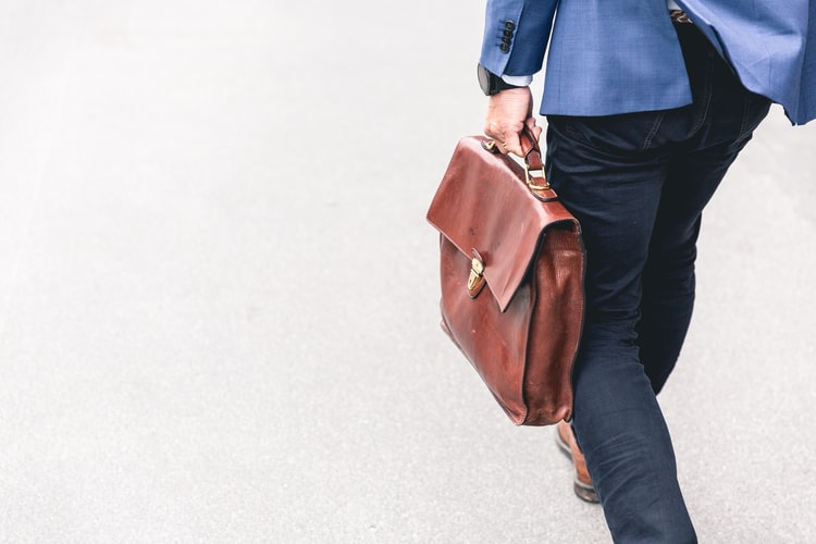 businessman walking with suitcase